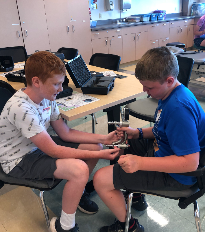 Youth participating in Hands on Science event.