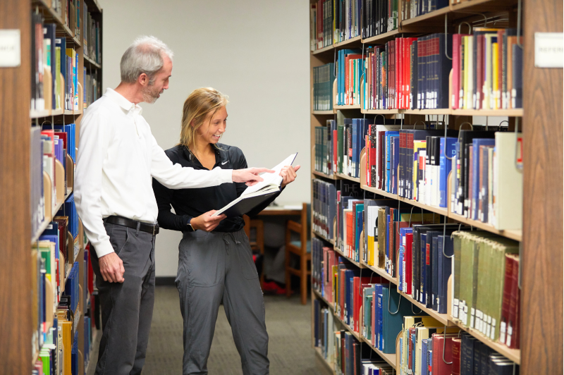 Librarian helping student in Murphy Library