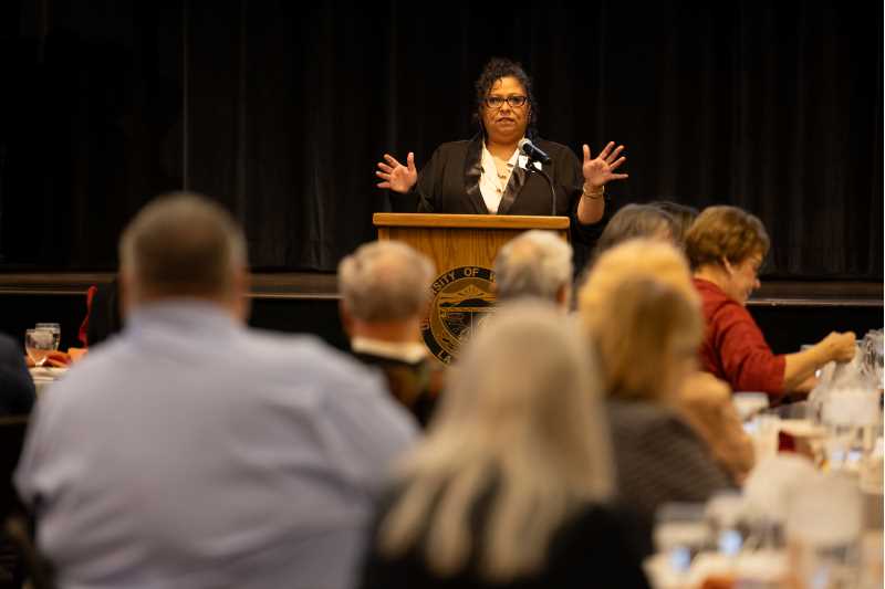 UW-La Crosse graduate and former Self Sufficiency Program participant Melissa Touche speaks during the 2023 scholarship breakfast. 