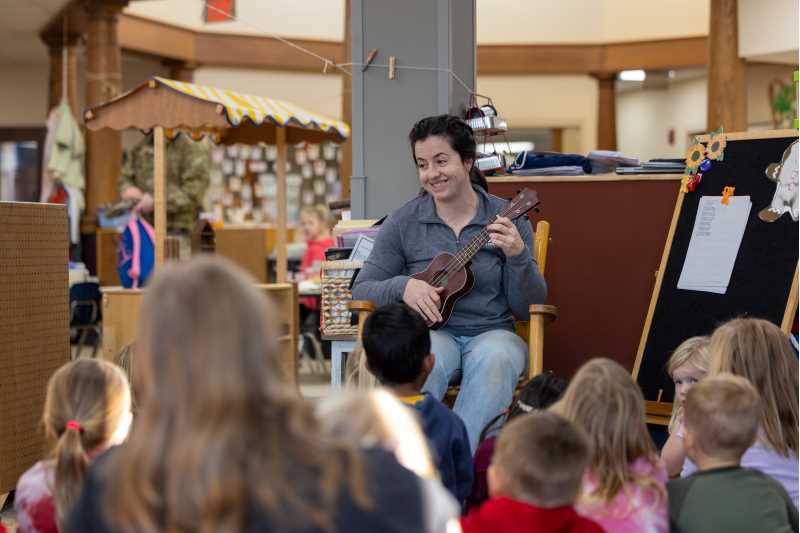 The Campus Child Center has been a cornerstone of support for the UWL campus for nearly four decades. (Pictured: Jodi Strong leading children in a song)