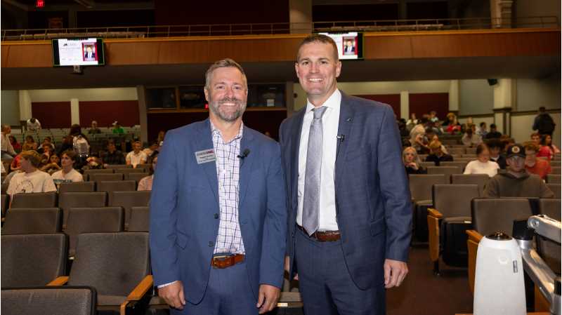 UWL College of Business Dean TJ Brooks (left) and Trust Point President and CEO Bill Bosch, '00, announced a new partnership that will help prepare students for successful careers in financial planning.