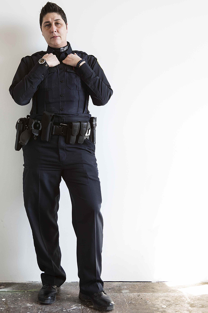 Image of a person in a police uniform. 