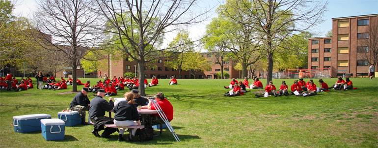 Photo of cadets sitting on lawn. 