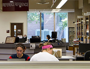 Students in reference area in library.