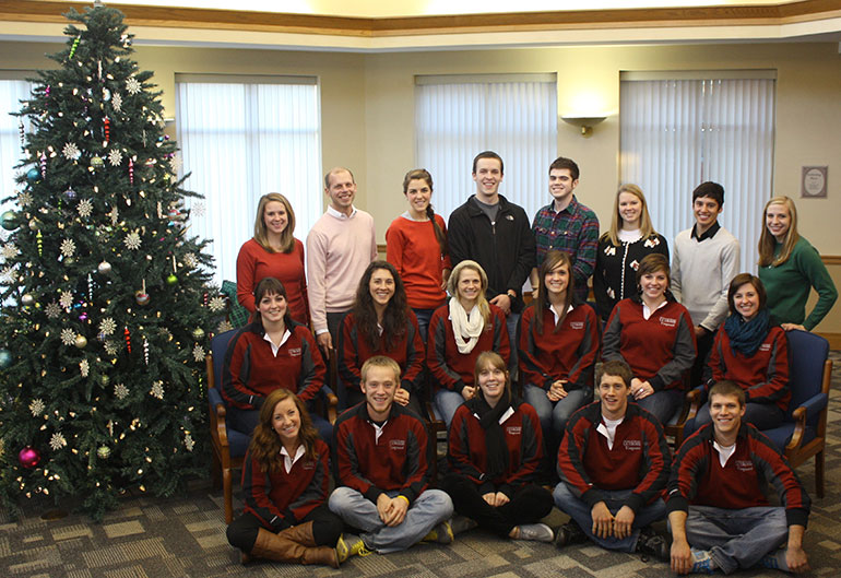 Group shot of Vanguards next to holiday tree.