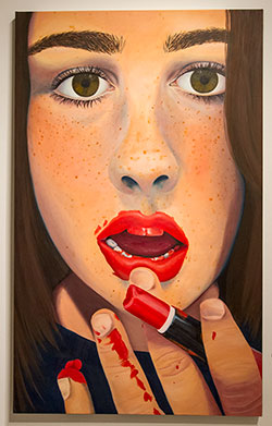 Painting of freckled girl with red lipstick. 