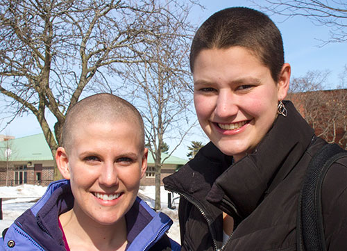 UW-L students Megan Kunstman, left, and Carlie Hopp, along with 106 others from campus and the community  joined more xxx by shaving their hair. 