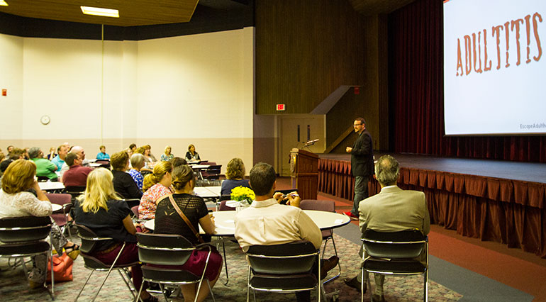 Image of Jason Kotecki speaking in front of a group at Valhalla, Cartwright Center. 