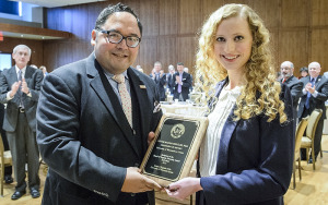 Victor M. Macias-Gonzalez (left), professor of history at UW-a Crosse, is presented with a UW Board of Regents Diversity Award by Student Regent Anicka Purath (right) during a Board of Regents meeting held in Varsity Hall inside Union South at the University of Wisconsin-Madison on Feb. 6, 2015. (Photo by Bryce Richter / UW-Madison)