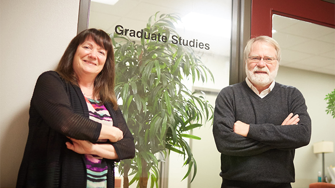 Chris Bakkum, Registrar, left, is a member of the initial Graduate Education Self-Study team that formed in 2014. She, Director of Graduate Studies Steve Simpson, right and other faculty worked on a self-study, a provost-funded external review, and a variety of other input sessions to help form a strategic plan for graduate education. 