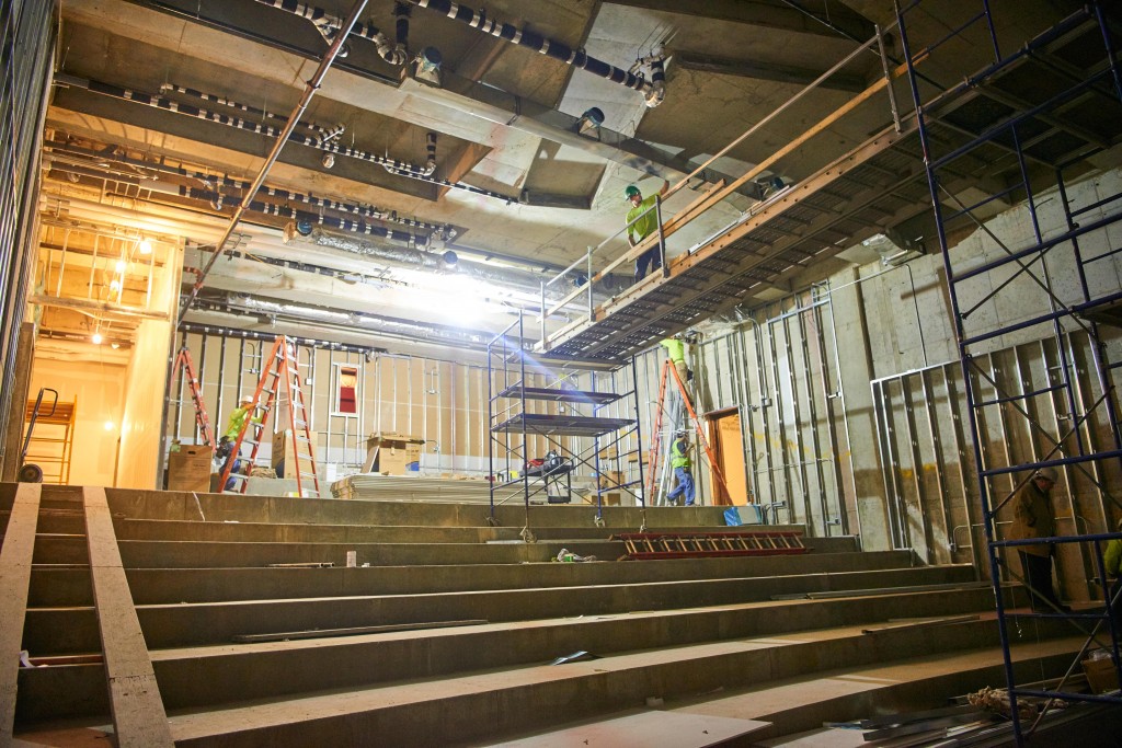 Contractors finish up HVAC and electrical in the movie theater.