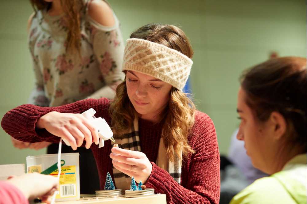 Marissa Duggan, a freshman biology major from Waukesha, uses a glue gun to prepare a tiny tree for a tiny snow globe during “holiday crafts on a budget” before winter break. The event was sponsored by “It Make$ Cents.”
Read more →