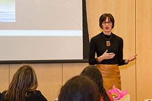 Image of Ariel Beaujot in front of a crowd talking.