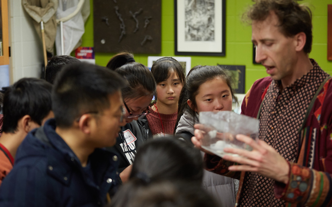 Barrett Klein showing students insects.