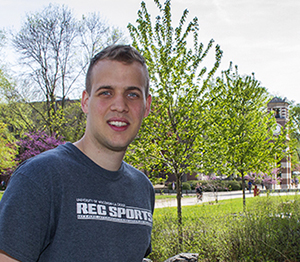 Image of Peter Molnar standing with Hoeschler Tower in the background.