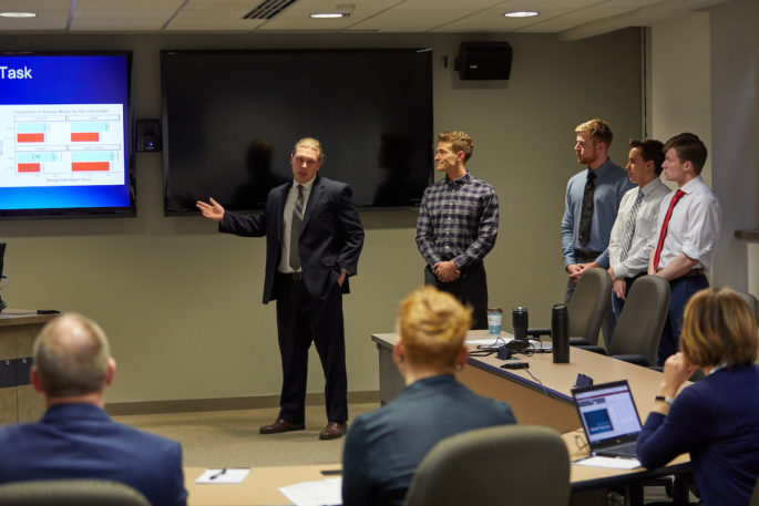 UWL senior Adam Crotteau presenting to the panel of local judges.