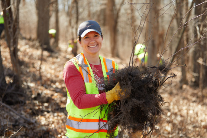 Faye Ellis, '01 and '05 cleaning up at Grandad Bluff.