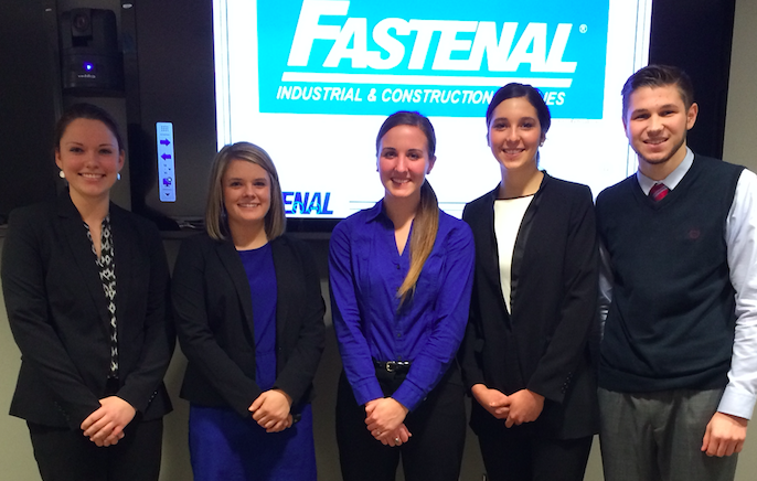 Image of students posing in front of a screen that says Fastenal