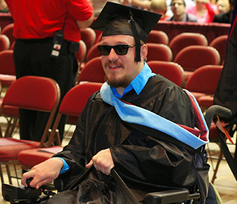 Image of Ryan Nell in graduation attire. 