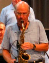 Greg Balfany playing a saxaphone.