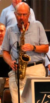 Greg Balfany playing a saxaphone.