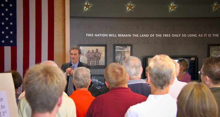 Chancellor Joe Gow talking to a group in the Hall of Honor.
