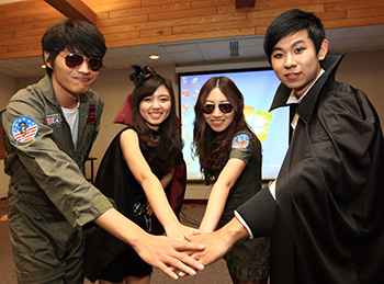 Four Chinese students dressed up for Halloween. 