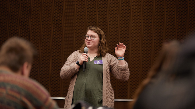 Keri Hetzel speaking to a group of people during School of Education Day.