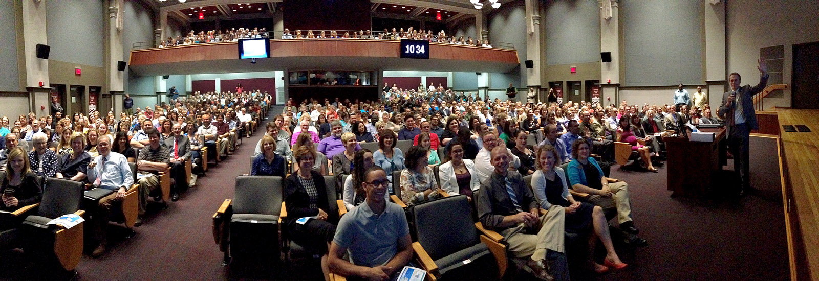 Image of everyone sitting in Graff Main Hall auditorium. 