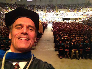 Selfie of Joe Gow infront of commencement audience. 