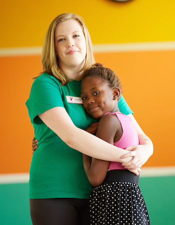 UWL senior Mackenzie Jones with a child at her YMCA internship.