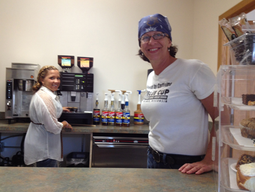 Lindsey Henslin, Western Technical College student in the culinary management program, working at Blue Cup Coffee shop with owner Kim Granum.