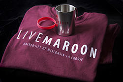 Image of LIVEMAROON T-shirt, cup and bracelet.