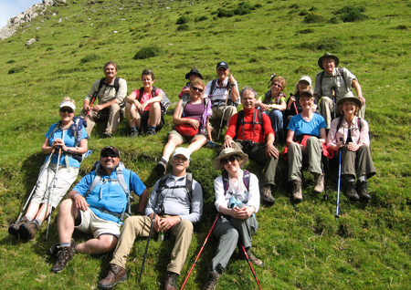 Irish hiking tour group rests after climbing to Maghanaboe, in the middle of the Dingle Peninsula of Ireland.
