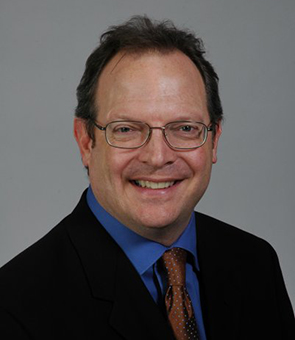 Headshot image of Mark Gibson.