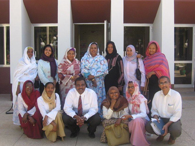 Mohamed Elhindi, UW-L chief information officer, poses for a picture with a group who recently completed training at a library in Sudan.