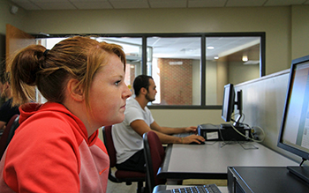 student looking at a computer screen. 