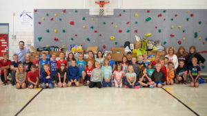 Students at Coon Valley Elementary School pose with UWL faculty and staff.