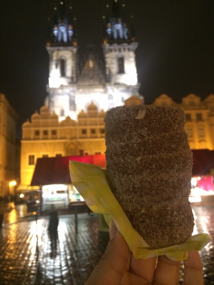 Image of the rolled pastry in someone's hand. 