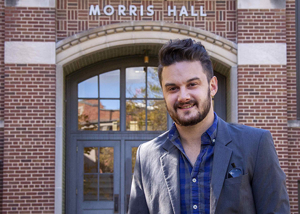 Image of Brian Puerling standing in front of Morris Hall. 