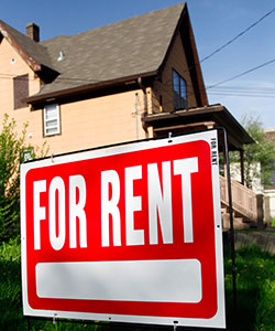 House with for rent sign. 