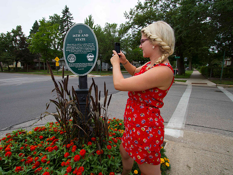 Julia taking photo of sign. 