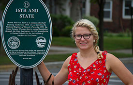 Julia next to sign.