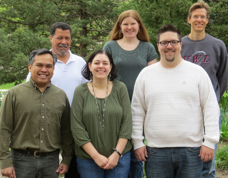 Image of the listed mathematics faculty members posing in front of trees. 