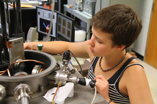 Loralee Bilke, a former UW-L physics student, working in the lab.