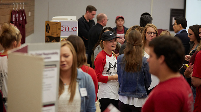 UWL Senior Marketing Major Greta Stawicki, center, says the CBA’s required courses have made her a more well-rounded student who feels ready for her future. She shares her experiences during the CBA Meet & Greet.