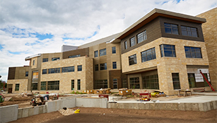 A view of the southeast side of the building, which faces the Veterans Memorial Field Sports Complex.