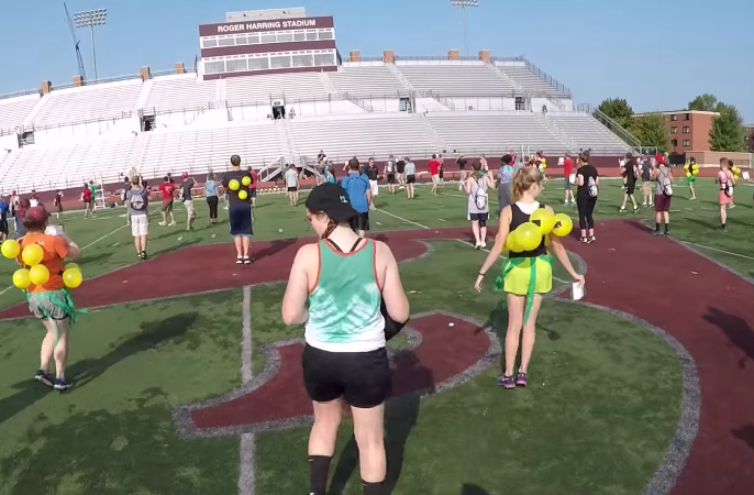 Students on the UWL football field.