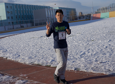 UW-L graduate Yutong Bo running on the track