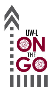 Image that says "UW-L On the Go" with wheels in the "o" of both words. 